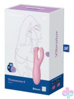 Satisfyer Threesome 4 lay-on vibrator with three flexible arms shown in pink on a neutral background
