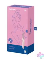 Twirling Delight pinpoint clitoral vibrator in pink and white with protective cap on neutral background