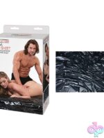 Oversized black waterproof vinyl bed sheet laid flat, 70x85 inches, by Lux Fetish