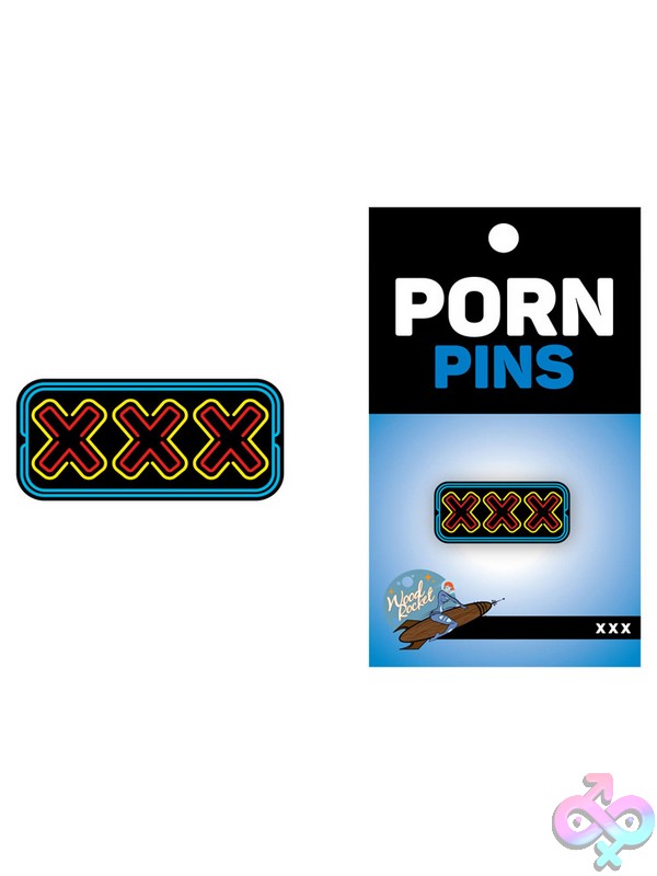 Discreet-Toys-Xxx-Pin-Nu-Epp-004 Red Xxx Soft Enamel Lapel Pin By Wood Rocket On A Plain Background